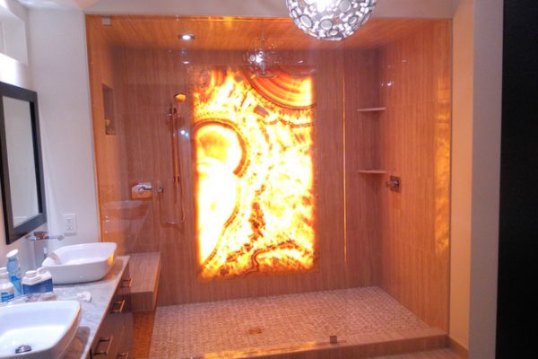Spacious bathroom with large shower and dual sinks.