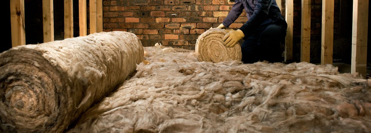 a person laying insulation